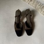 Chanel Suede Slingback sandal with a brown suede body and contrasting black toe cap