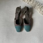 Chanel Suede Slingback sandal with a brown body and contrasting green toe cap