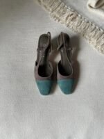 Chanel Suede Slingback sandal with a brown body and contrasting green toe cap