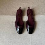 Chanel slingback shoes crafted "dark burgundy with black patent toe cap"