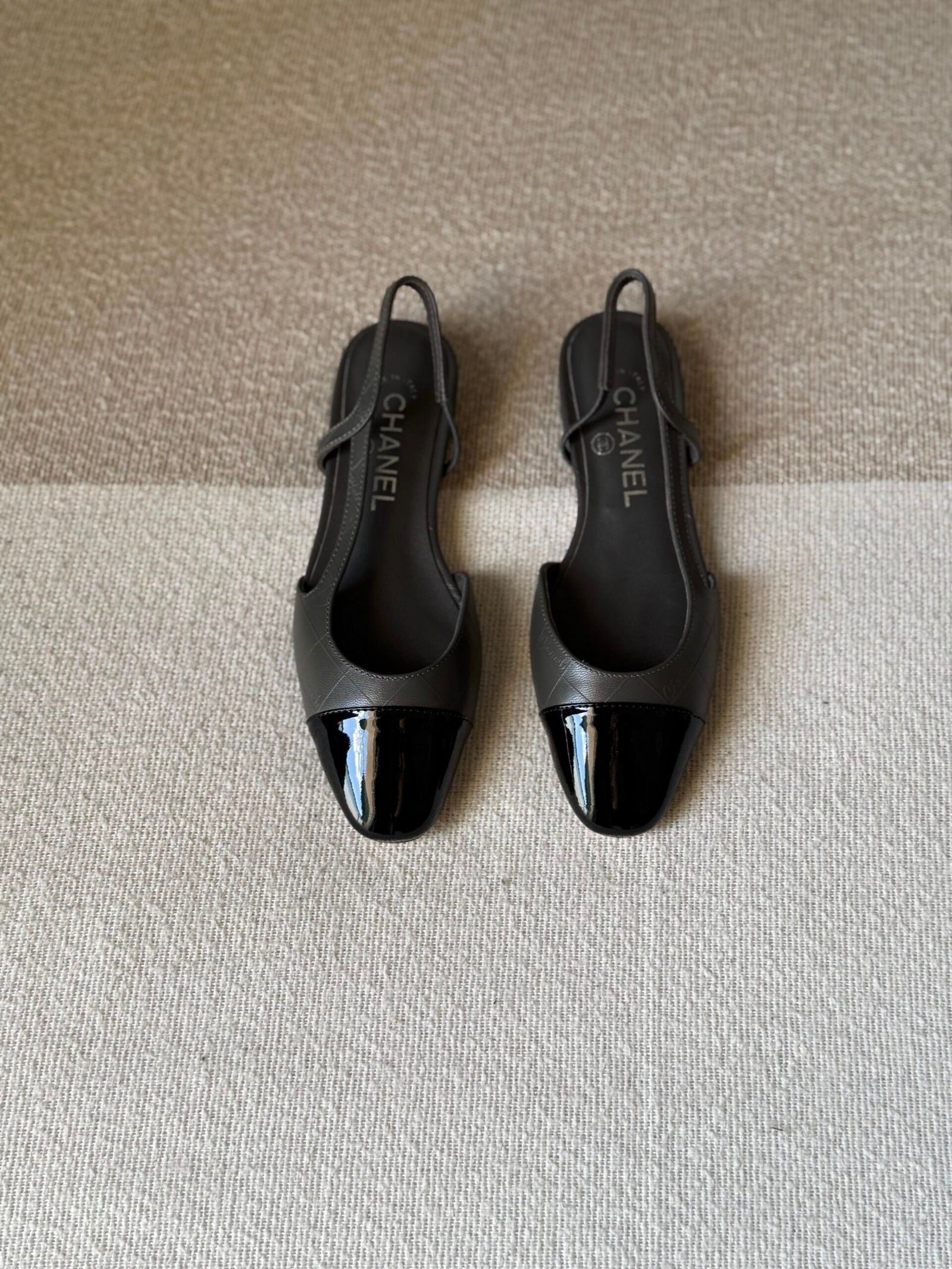 WhatsApp Image 2026-07-06 at 02.32.28 (1) Chanel slingback shoes crafted "grey leather with black patent toe cap" - Image 1