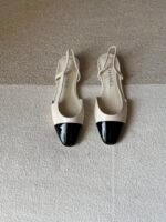 Chanel slingback shoes crafted "White with black patent toe cap"
