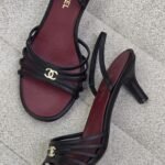 Chanel Black Leather strappy sandals with a gold CC logo & wine-red insole