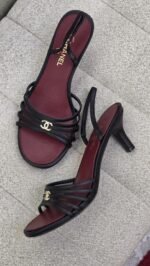 Chanel Black Leather strappy sandals with a gold CC logo & wine-red insole