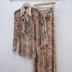 Zimmermann Rebellion pussy-bow blouse and matching flare pant "intricate floral paisley print"