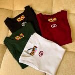GUCCI tank top a vibrant check- patterned interior tag & a prominent embroidered emblem on the chest