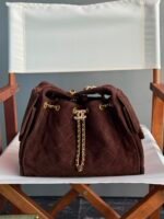 Chanel 25 handbag crafted from suede calfskin with gold-tone metal hardware