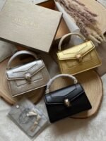 Bulgari Serpenti Forever top-handle bag with a snakehead magnetic closure