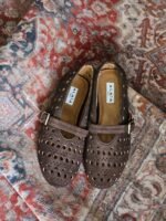 Alaïa  Vienne ballet flats perforated dark brown suede & a buckle strap