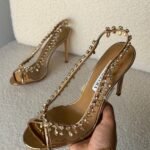 Aquazzura Temptation crystal sandals in a gold tone shade