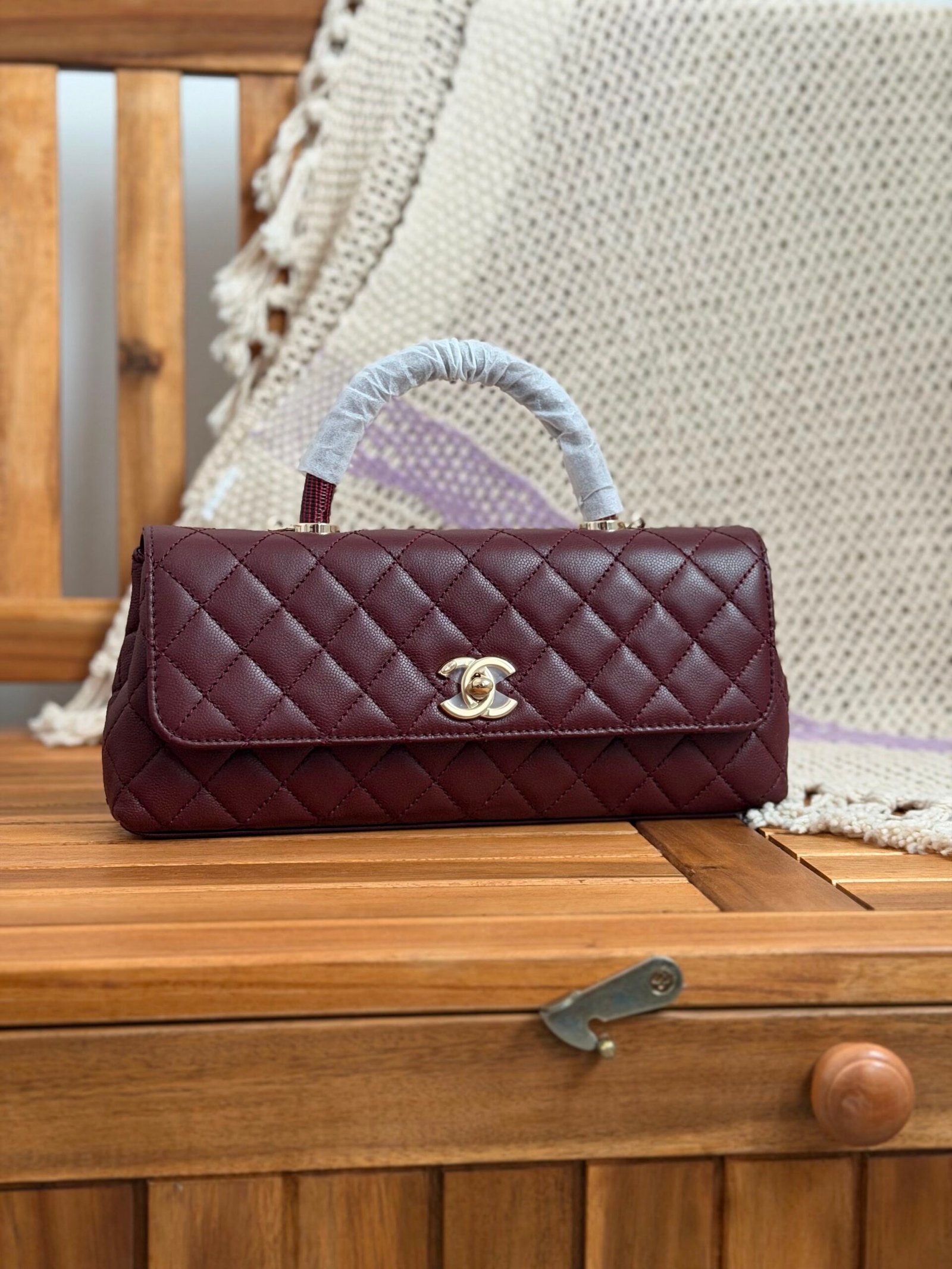 WhatsApp Image 2026-07-27 at 03.01.06 (1) Chanel Coco Handle Eat West Flap Bag in Burgundy quilted leather with iconic gold CC lock - Image 1