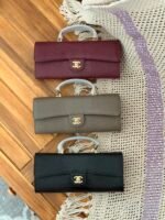 Chanel Lizard Embossed Calfskin Top Handle Long Clutch with iconic gold tone CC lock