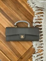 Chanel Lizard Embossed Calfskin Top Handle Long Clutch with iconic gold tone CC lock - Image 5
