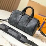 Louis Vuitton Keepall Bandouliére 25cm Monogram Eclipse coated canvas with black leather trim