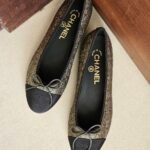 Chanel metallic bronze and black ballet flats with signature grosgrain bow