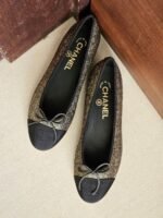 Chanel metallic bronze and black ballet flats with signature grosgrain bow