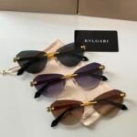 Bvlgari BV6191-B-D sunglasses a rimless, cat-eye design with golden metal accents