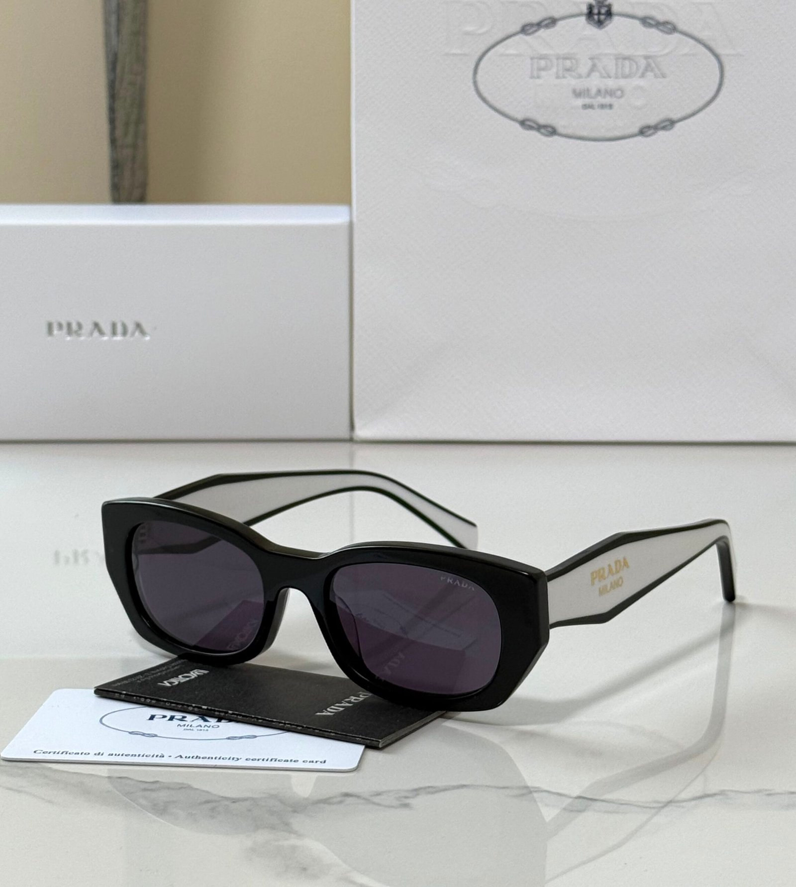 WhatsApp Image 2026-07-29 at 02.27.35 Prada PR B05S sunglasses "Black acetate pillow frame with dark grey lenses - Image 1