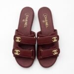 Chanel lambskin mules with gold-tone hardware & embellished logo details
