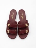 Chanel lambskin mules with gold-tone hardware & embellished logo details