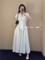 ALAÏA Linen-Blend knot midi dress structured bodice & relaxed dolman sleeves - Image 5
