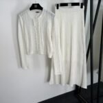 Sandro knitted set structured cardigan with pearl button details & a matching ribbed skirt