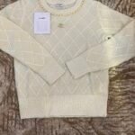 Chanel sweater prominent quilted diamond pattern & delicate pearl embellishments