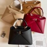 Dior Cigale Bag structured architectural silhouette in shiny supple calfskin accented with a delicate front bow detail