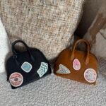 Hermès limited-edition Bolide mini pique-colle bags in noir & caramel mysore goatskin