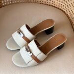 Hermès Gigi 50 sandal in cream & tan leather