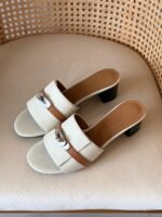 Hermès Gigi 50 sandal in cream & tan leather