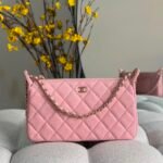 Chanel Diamond-quilted cavier leather clutch with chain an interlocking CC logo & a leather wrapped top handle