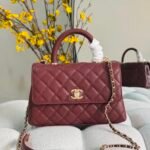 Chanel Flap Bags with Top handle chevron patterened with gold tone CC turn-lock closures