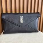 Saint Laurant Cassandre envelope clutch in iconic gold-tone YSL monogram