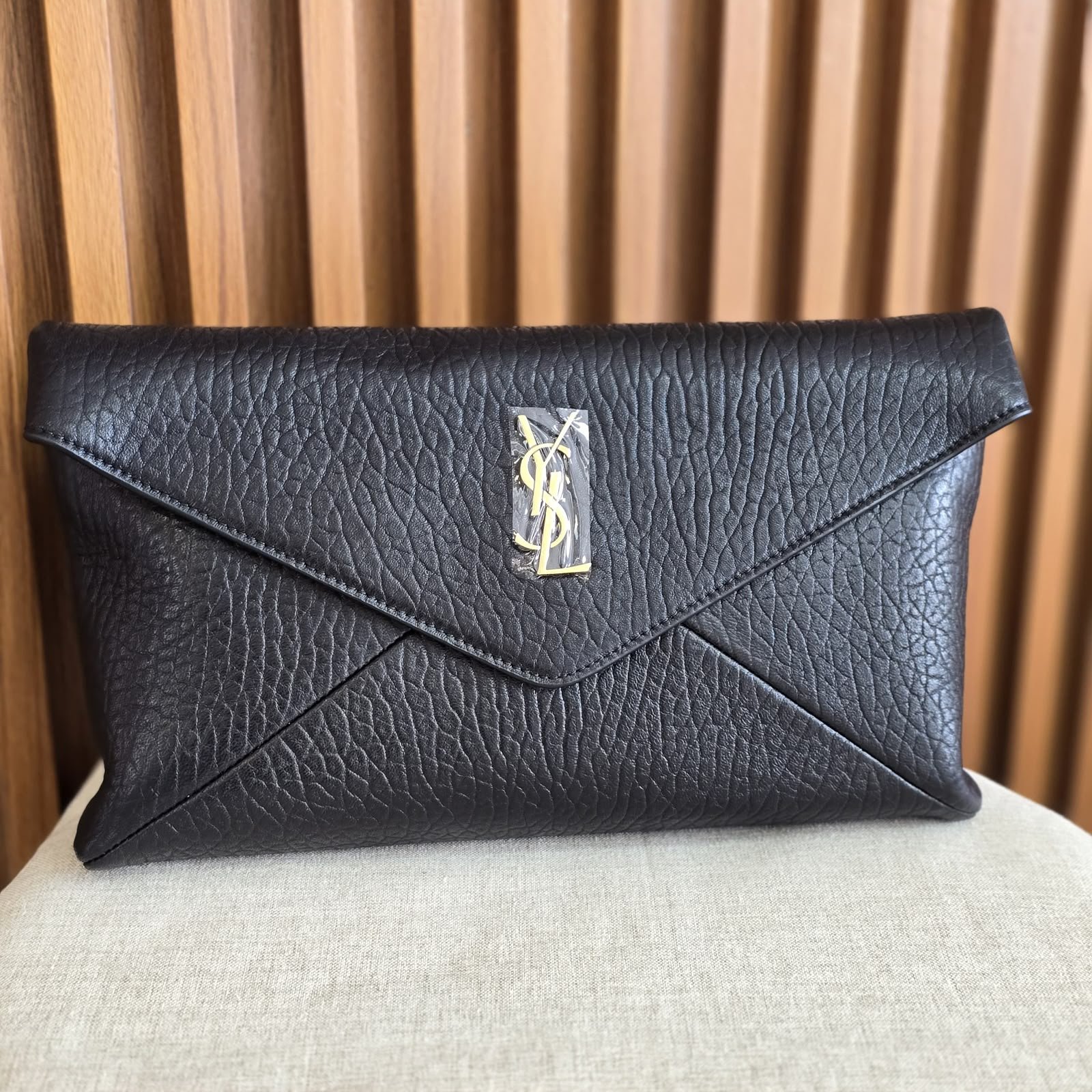 WhatsApp Image 2026-08-20 at 20.33.33 Saint Laurant Cassandre envelope clutch in iconic gold-tone YSL monogram - Image 1