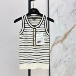 Chanel Black & White striped knit tank top prominent gold-tone CC logo Buttons down the front placket