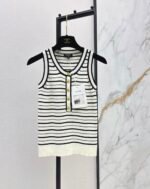 Chanel Black & White striped knit tank top prominent gold-tone CC logo Buttons down the front placket
