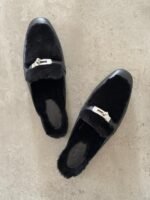Hermès Oz Mules in Black, Crafted in tan leather with plush ecru shearling lining & a silver tone kelly buckle
