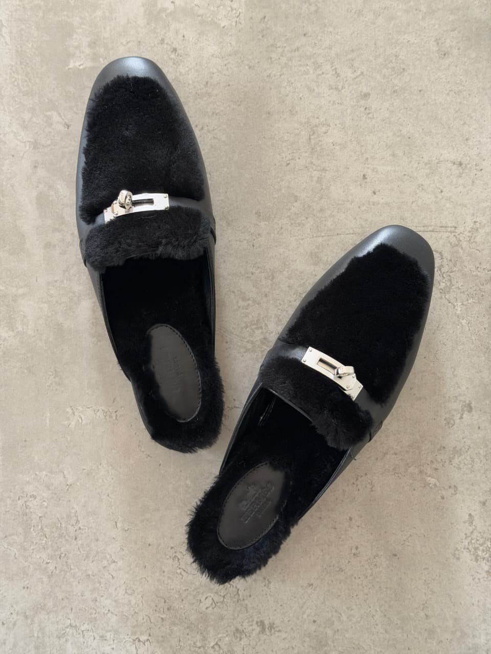WhatsApp Image 2026-09-14 at 17.29.39 Hermès Oz Mules in Black, Crafted in tan leather with plush ecru shearling lining & a silver tone kelly buckle - Image 1